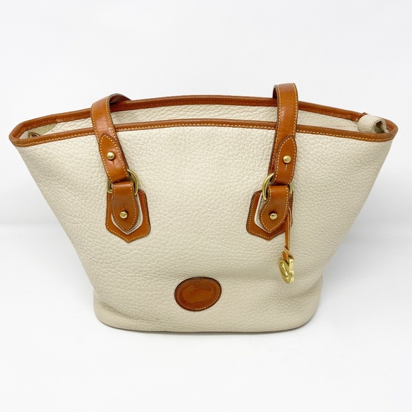 Buy the Vintage Dooney & Bourke All-Weather Leather Speedy Handbag Satchel  in Bone White/British Tan